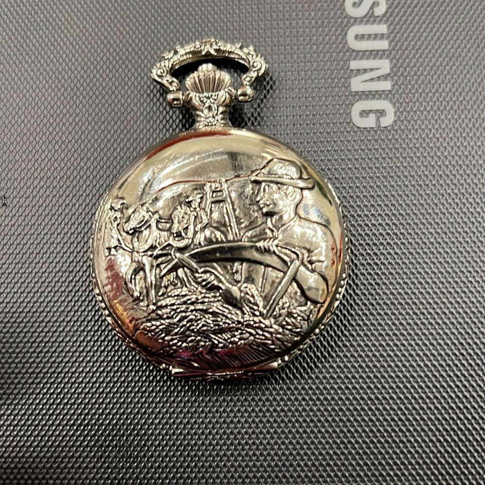 Old school vintage retro pocket watch silver in color